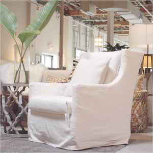 White chair in fabric slip cover