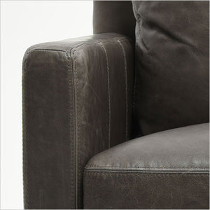 leather armchair with nail head trim